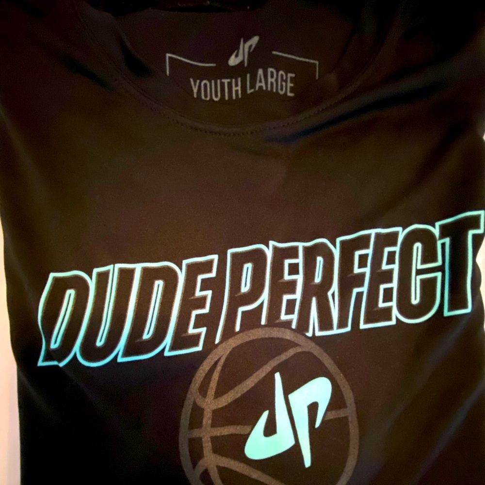 World’s coolest black-on-black, with an aqua poppin’ “DP” basketball t-shirt
